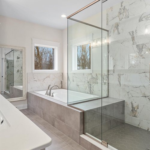 Modern Bathroom with Marble Tiles in Crown Point, IN by Crown Flooring