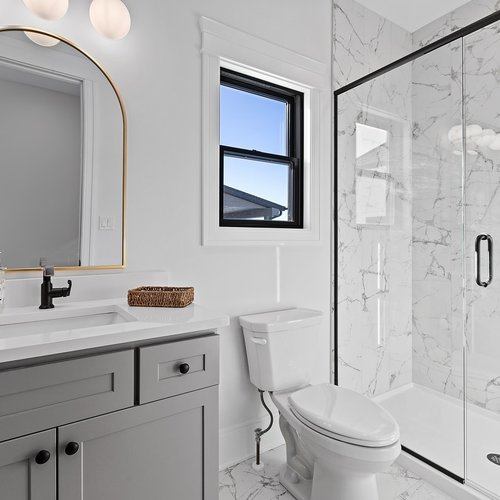 Modern Bathroom with Marble Tiles in Crown Point, IN by Crown Flooring